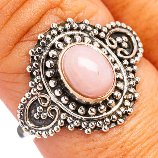 Pink opal cabochon ring with ornate .925 sterling silver filigree band