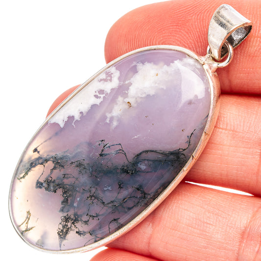 Silver-plated oval pendant with lavender stone and dark mossy inclusions, top bail