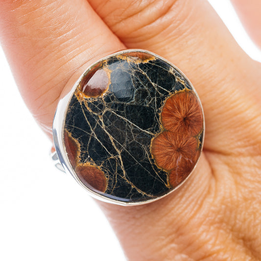 Sterling silver oval inlay ring with dark obsidian stone and amber-brown patches