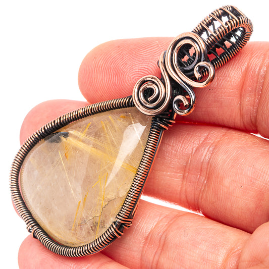Rutilated quartz wire wrap pendant, teardrop clear stone with copper coil and loops