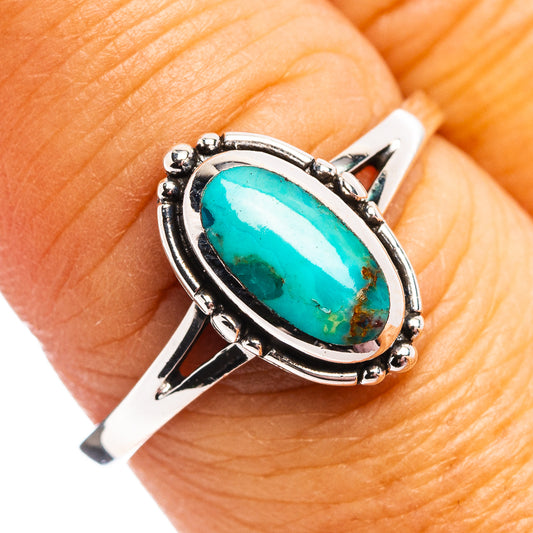 Turquoise oval sterling silver ring with raised bezel and small bead accents