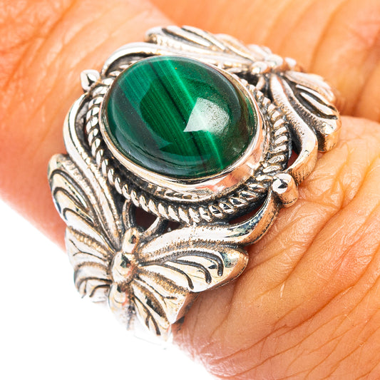 Sterling silver butterfly ring with oval green malachite cabochon, carved side wings.