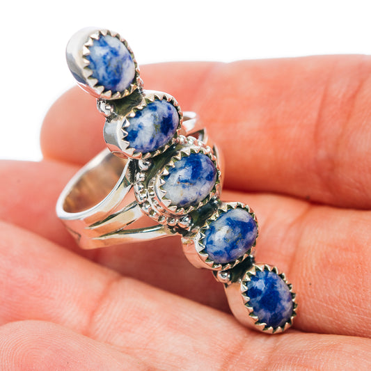Five-stone blue gemstone ring in sterling silver, side view with shield settings