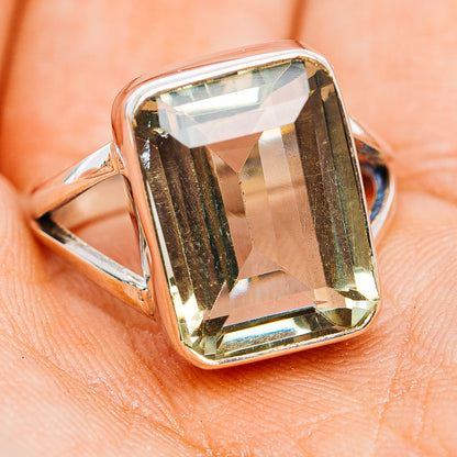Sterling silver ring with angled view of square faceted green amethyst