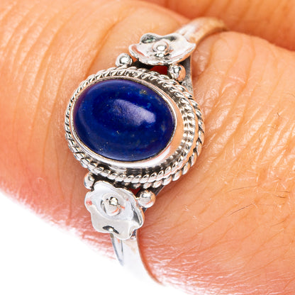Sterling silver lapis lazuli flower ring with oval blue gemstone and rope border