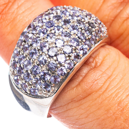 Sterling silver ring with tanzanite-colored faceted stones, domed halo top