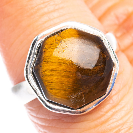 Tiger's eye gemstone sterling silver ring, size 7.25, faceted oval setting.