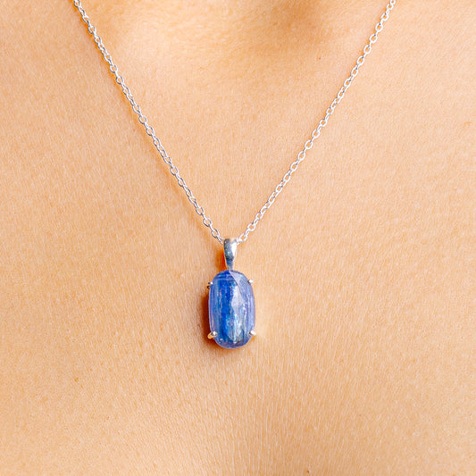 Sterling silver kyanite pendant necklace with oval blue gemstone on a fine chain