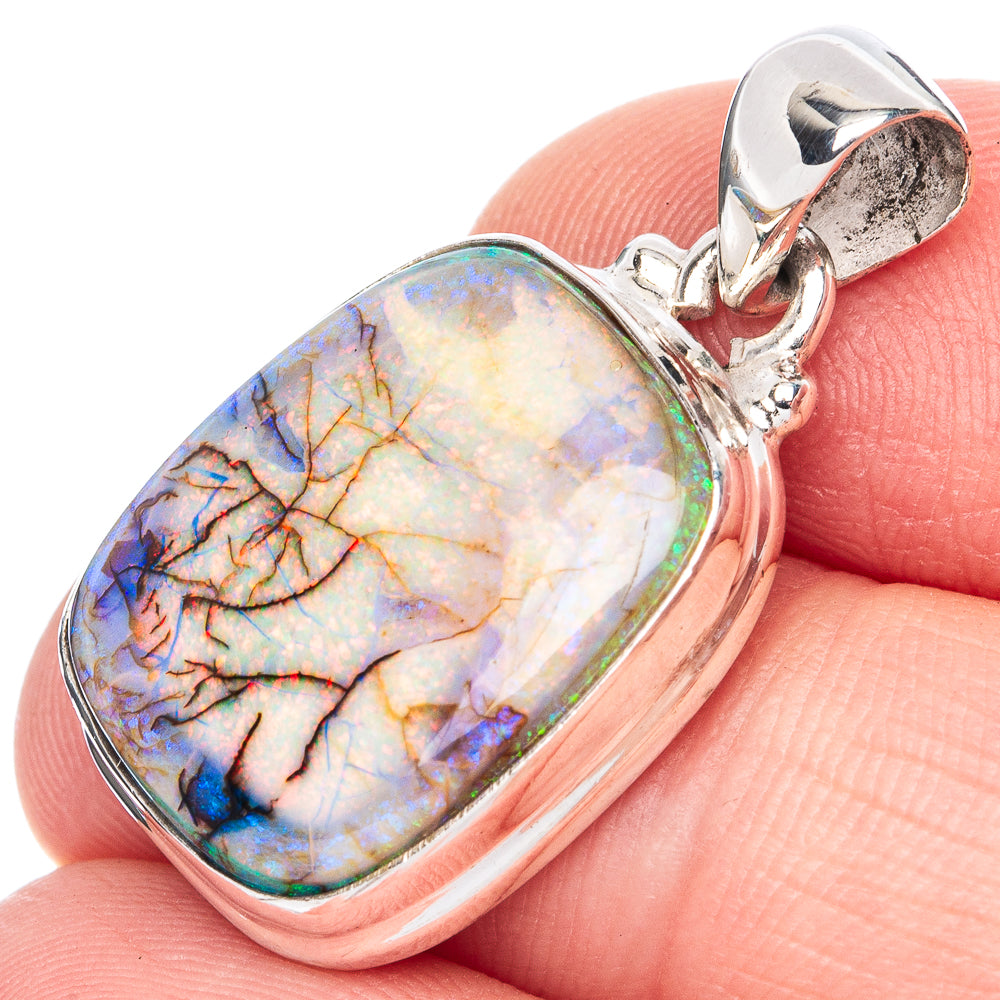 Sterling silver oval opal pendant with multicolor blue, orange, and yellow cabochon