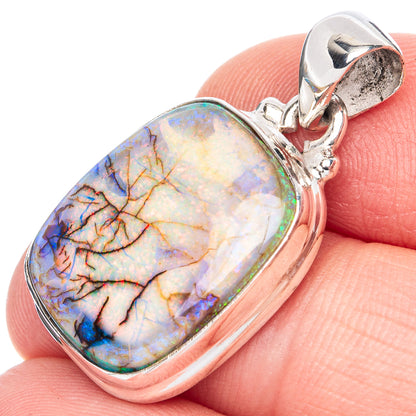Sterling silver oval opal pendant with multicolor blue, orange, and yellow cabochon