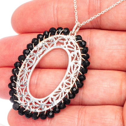 Black onyx necklace, oval sterling silver filigree pendant with black bead border