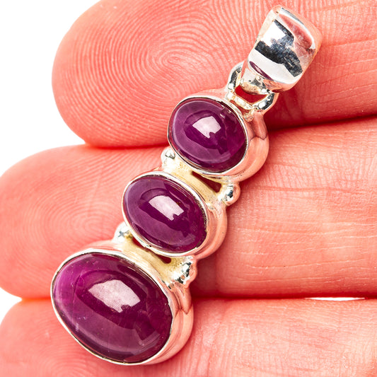 Three-stone ruby pendant in .925 sterling silver with three oval purple stones