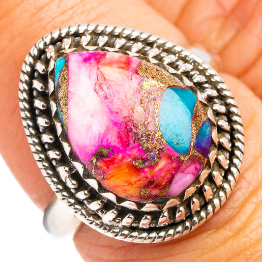 Sterling silver ring with oval multicolor gemstone and turquoise blue accents, rope bezel