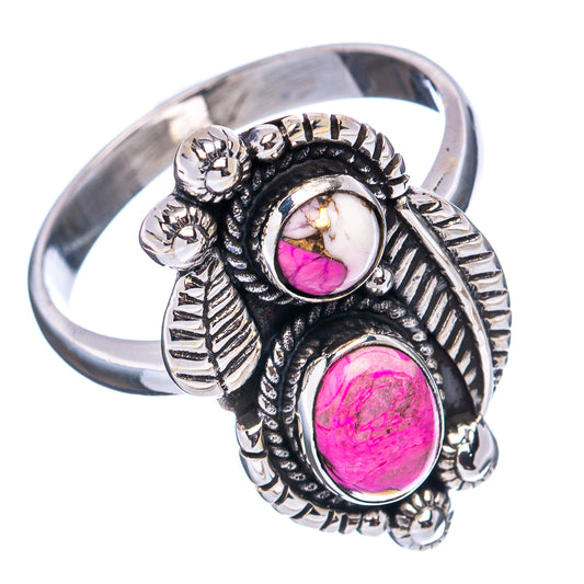 Sterling silver ring with two oval pink stones and engraved accents on the band