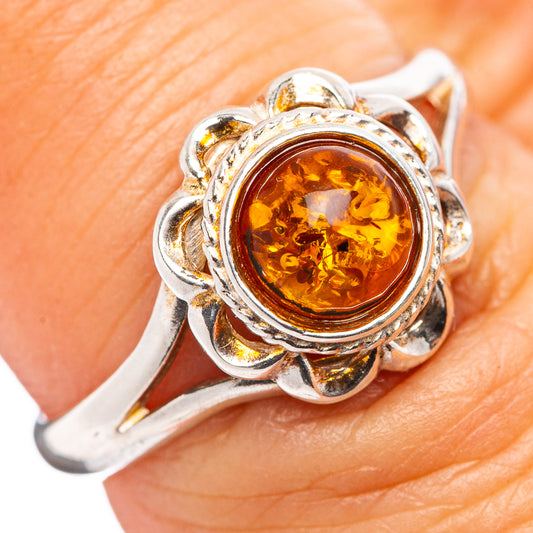 Sterling silver amber ring with round amber cabochon and ornate flower setting