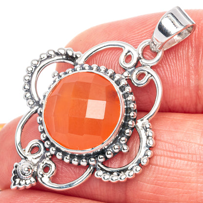 Sterling silver carnelian pendant with faceted round orange gemstone and hanging bail