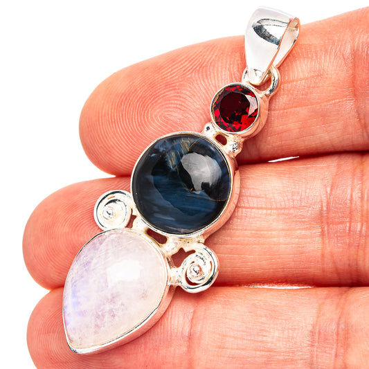 Sterling silver multi-stone pendant with dark blue, red, and pale oval stones