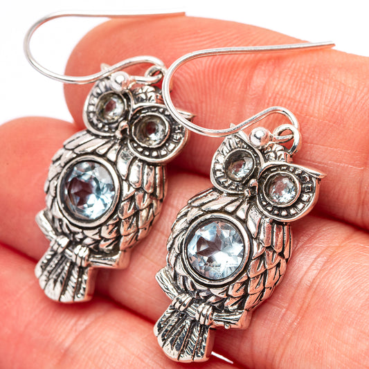 Sterling silver owl earrings with blue round stones and fishhook closures