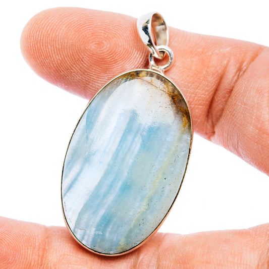 Oval Aquatine Lemurian calcite pendant with blue streaks in .925 sterling silver bezel
