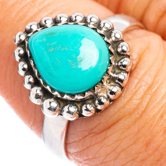 Turquoise oval cabochon sterling silver ring with bead bezel and textured band