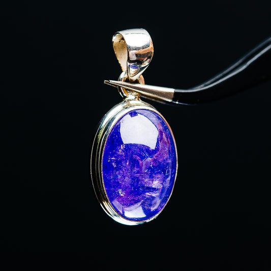 Oval tanzanite gemstone pendant with .925 sterling silver bezel, blue cabochon