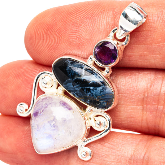 Sterling silver multi-stone pendant with oval dark blue and purple gemstones, bail top