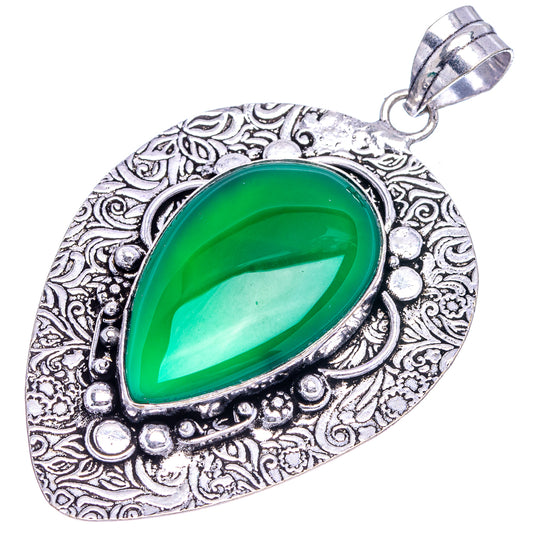 Green onyx teardrop pendant in German silver with detailed engraved border
