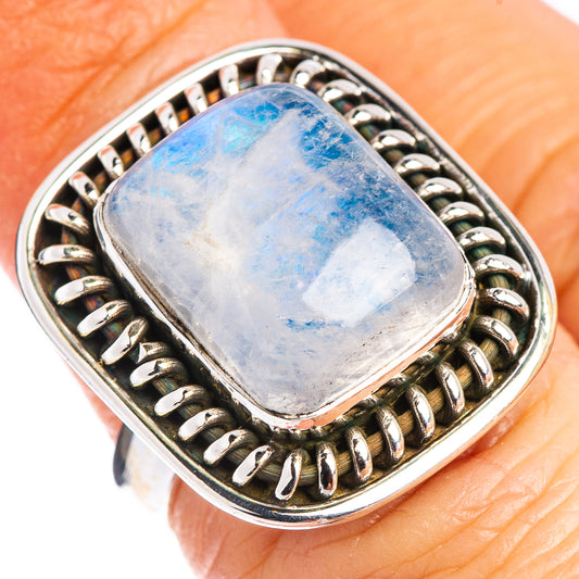 Sterling silver ring with blue moonstone cabochon and bezel of oval wire links