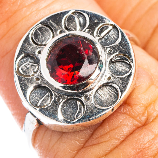 Sterling silver dainty ring with round red garnet and ornate scroll setting
