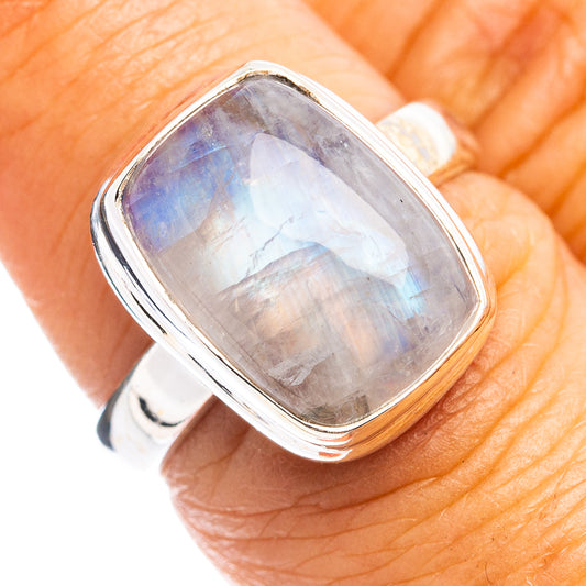 Moonstone ring with rectangular silver bezel, iridescent pale blue stone on band