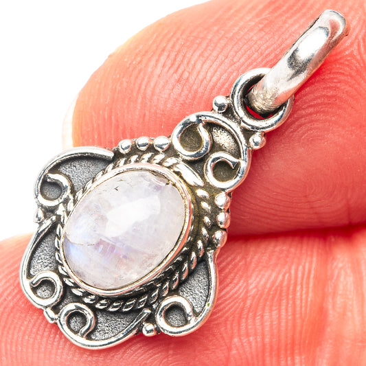 Sterling silver moonstone pendant with oval rainbow cabochon and ornate oval frame