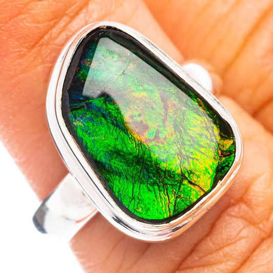 Sterling silver ammolite ring with oval iridescent green stone in bezel setting