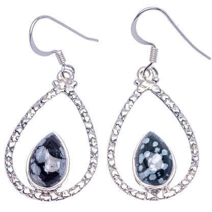 Teardrop obsidian dangle earrings with ornate silver border and speckled dark stones