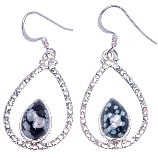 Teardrop obsidian dangle earrings with ornate silver border and speckled dark stones