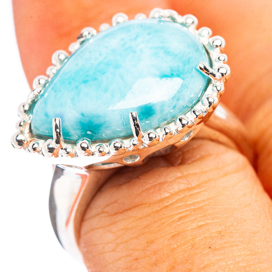 Sterling silver larimar ring with oval blue gemstone and beaded halo settings