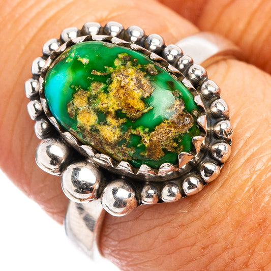 Sterling silver oval turquoise ring with raised setting, green-blue stone and beaded rim