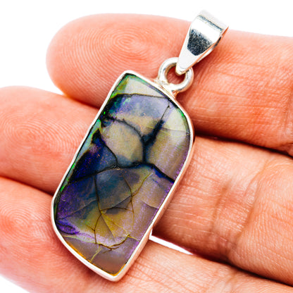 Sterling silver pendant with iridescent opal rectangle stone, bezel-set in a frame