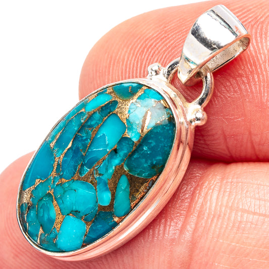 Sterling silver turquoise oval pendant with blue cabochon and gold matrix, bail loop.