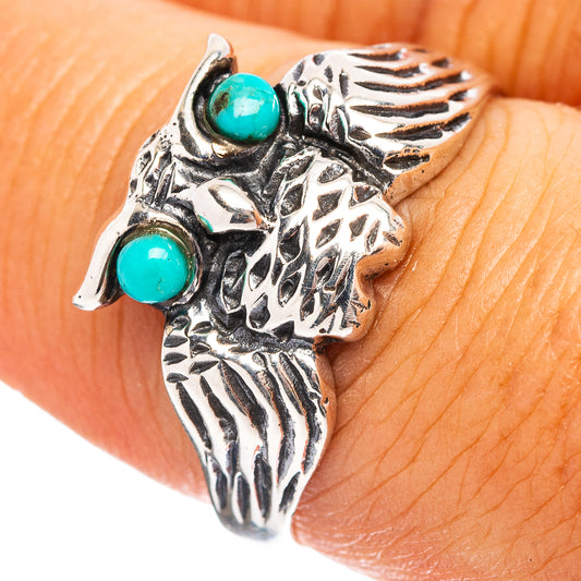 Sterling silver owl ring with two turquoise cabochon stones, intricate etched details