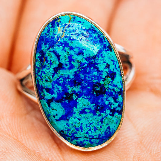 Sterling silver ring with oval blue-green speckled stone, side angle