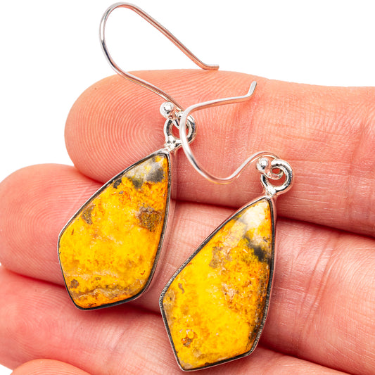 Close-up teardrop amber jasper drop earrings with .925 sterling silver hooks.
