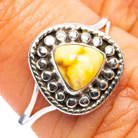 Bezel-set oval yellow turquoise ring in sterling silver, decorative border