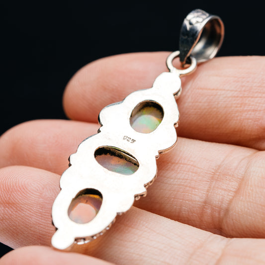 Sterling silver opal pendant back with three oval cutouts and engraved bail loop