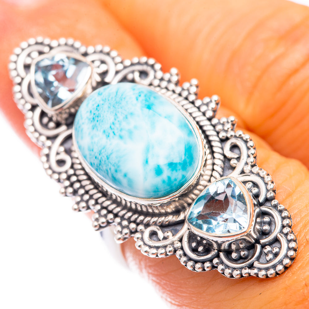 Sterling silver ring with oval blue-green stone and small oval blue accents