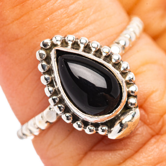 Dainty black onyx teardrop ring with sterling silver bead bezel and scalloped band