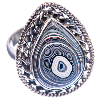 Sterling silver oval ring featuring concentric blue-gray swirl cabochon