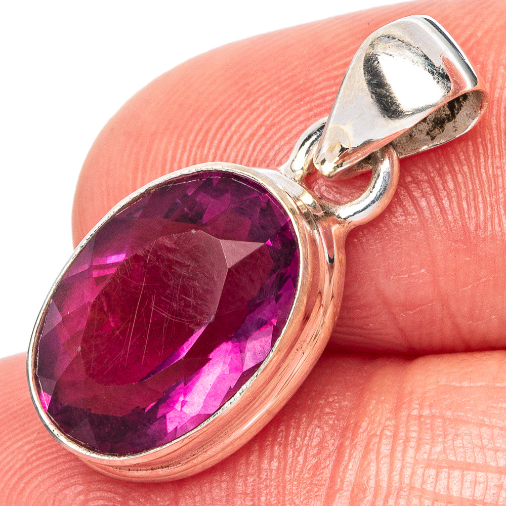 Faceted pink fluorite pendant with oval gemstone in sterling silver bezel, with bail
