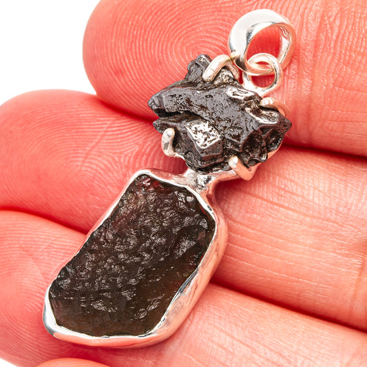 Sterling silver pendant with dark rough meteorite-style stone and loop bail