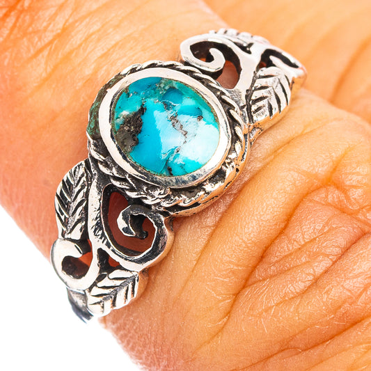 Turquoise cabochon sterling silver ring with ornate engraved band