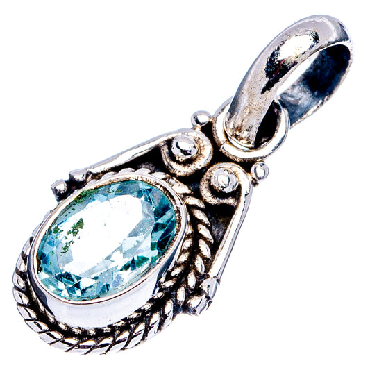 Sterling silver pendant with oval blue topaz, ornate raised frame and top loop bail